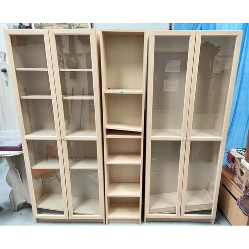 895 - A modern pale wood effect pair of book cases/ display cases with full height glazed doors and a matc... 