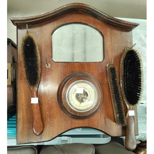 17 - An Edwardian walnut slope front coal box; a wall hanging hall brush rack (barometer)