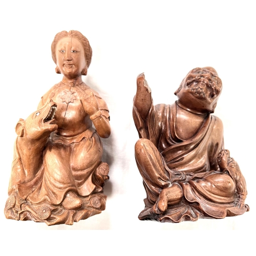 383 - 2 Chinese late Ching carved hardwood figures of male and female with animals height 18 and 22 cm