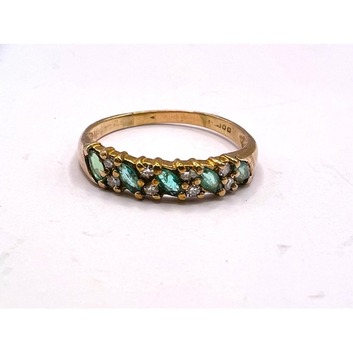 733 - A gold dress ring, hallmarks worn, set with 5 emerald coloured stones and smaller diamonds around, s... 