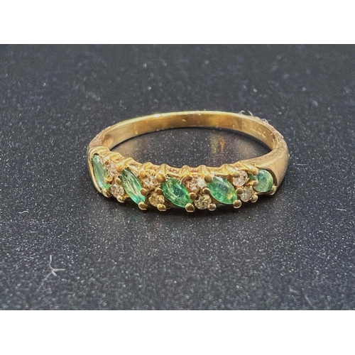 733 - A gold dress ring, hallmarks worn, set with 5 emerald coloured stones and smaller diamonds around, s... 