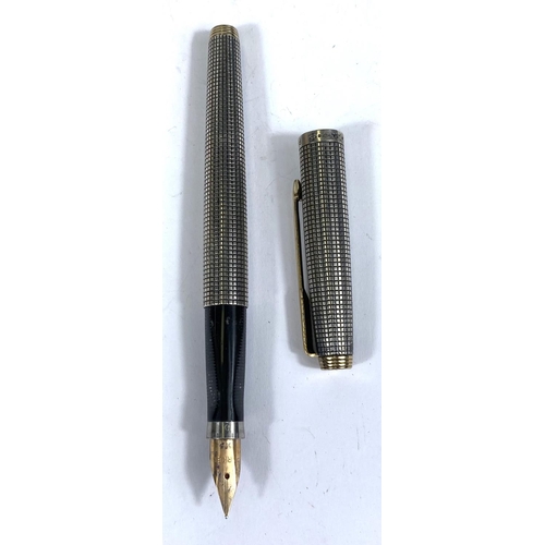 153 - A Parker fountain pen the sterling silver body with crosshatched detail, 14k gold nib stamped '585'