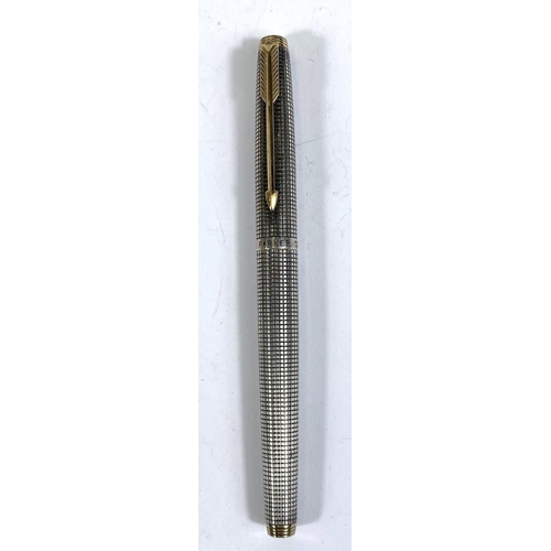 153 - A Parker fountain pen the sterling silver body with crosshatched detail, 14k gold nib stamped '585'