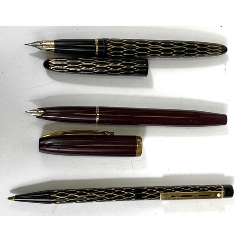 155 - A lady's Schaeffer fountain pen with black and gilt body, a similar ballpoint; another Schaeffer fou... 