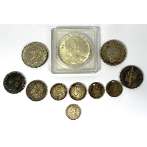 204 - A selection of foreign silver coins including a 1965 Canada dollar