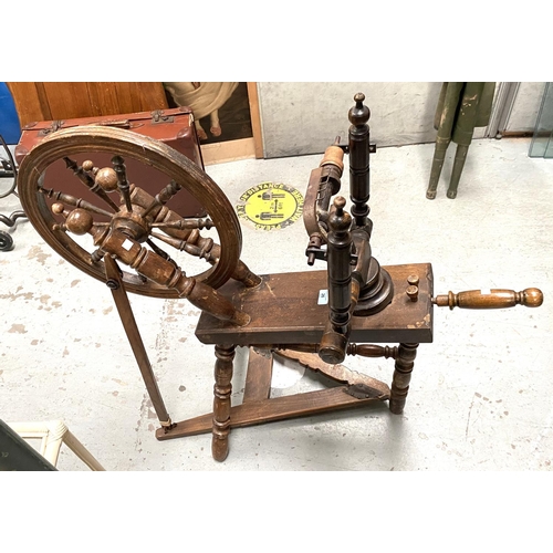 26 - A late 19th/early 20th century wooden spinning wheel with foot pedal etc