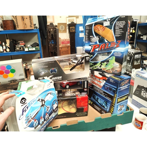 289 - A selection of remote control vehicles, a Nikko Mini Cooper, a Salvation remote control helecopter e... 