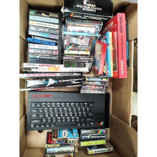 297 - A vintage Sinclair ZX Spectrum + computer and a good selection of various games etc