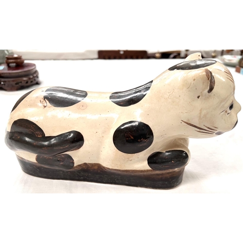 380 - A Chinese ceramic neck rest in the form of a cat length 27cm