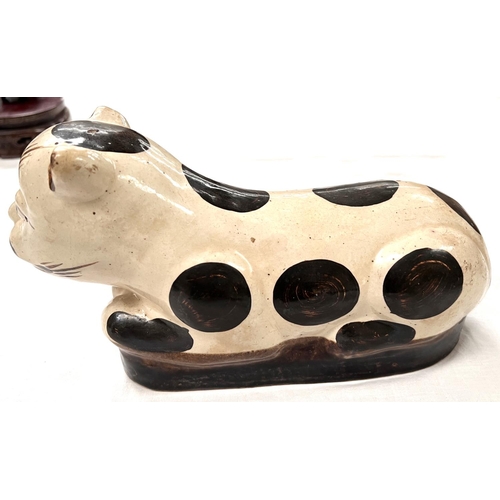 380 - A Chinese ceramic neck rest in the form of a cat length 27cm