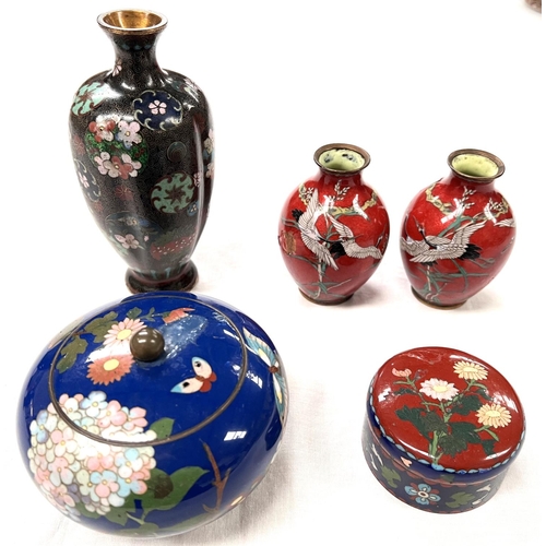 385 - A group of cloisonne vases and items including a pair of red ground vases with cranes lobed vase etc... 