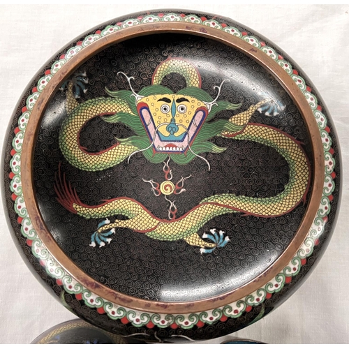 391A - A Chinese cloisonne black ground bowl decorated with dragons and a similar cup