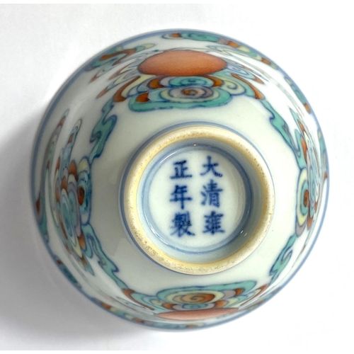 412 - A Chinese tea bowl with polychrome decoration and six character mark to base, diameter 7.5cm