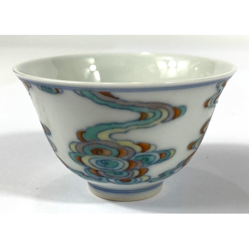 412 - A Chinese tea bowl with polychrome decoration and six character mark to base, diameter 7.5cm