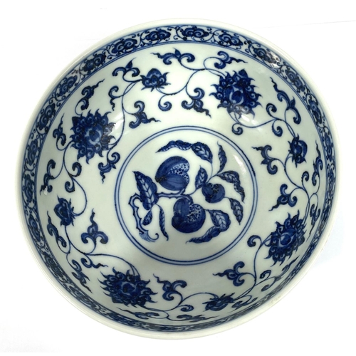 416 - A Chinese blue and white bowl decorated with flowers and fruits etc with six character mark to base,... 