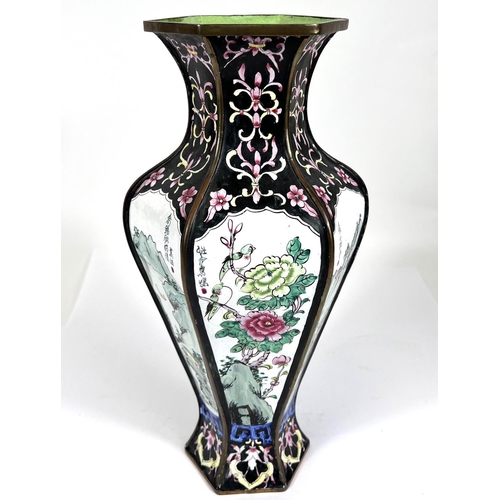 422 - A 20th century Chinese hexagonal baluster vase with decorative panels of landscapes, birds, etc., wi... 