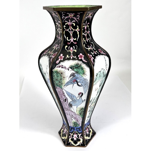 422 - A 20th century Chinese hexagonal baluster vase with decorative panels of landscapes, birds, etc., wi... 