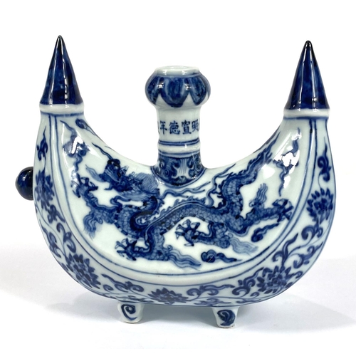 426 - A Chinese blue and white boat shaped 'Pilgrims Flask' decorated with dragon to the body, small bulbo... 