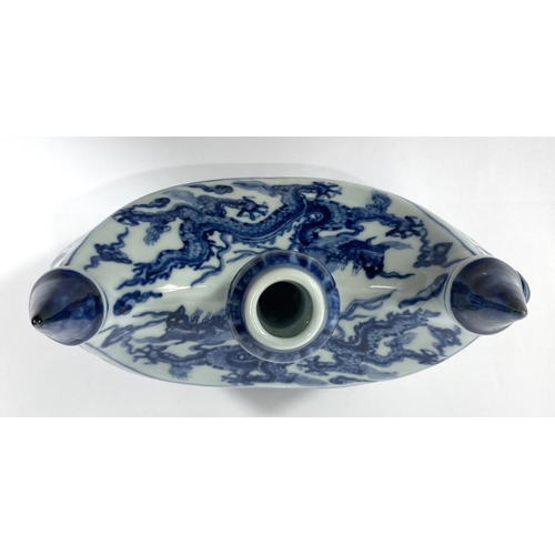 426 - A Chinese blue and white boat shaped 'Pilgrims Flask' decorated with dragon to the body, small bulbo... 