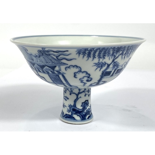 427 - A large Chinese blue and white stem cup with traditional decoration, domestic scene trees plants etc... 