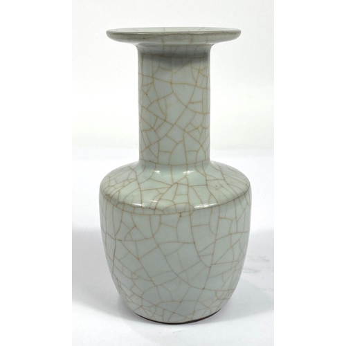 428 - A Chinese pale green crackle glazed vase with flared rim, height 18cm