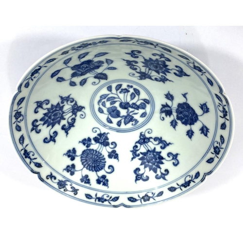 429 - A Chinese blue and white bowl with lobbed rim, floral decoration to the interior a six character mar... 