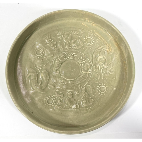 430 - Two Chinese green glazed dishes with relief decorated scenes to base of dishes, diameter 22cm and 20... 