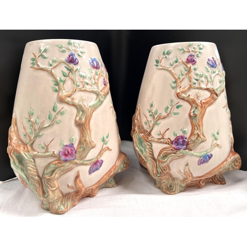 469 - Clarice Cliff for Newport Pottery:  a pair of ovoid vases with relief decoration of flowering b... 