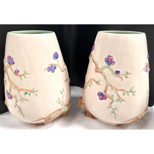 469 - Clarice Cliff for Newport Pottery:  a pair of ovoid vases with relief decoration of flowering b... 