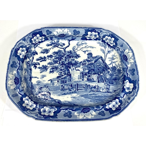 538 - DAVENPORT: A 19th century blue and white transfer decorated meat platter with rural genre scene... 