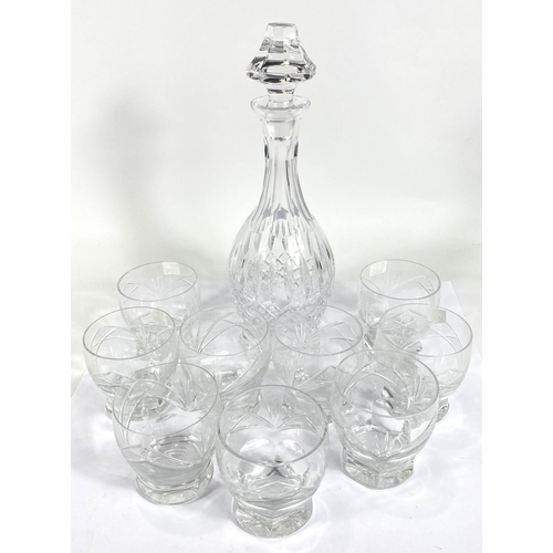 549 - 9 rounded cut glass tumblers and a bulbous glass decanter