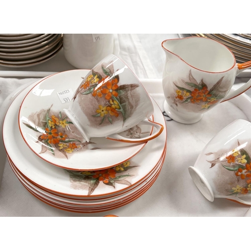 591 - An Art Deco Shelley part tea service with flowers and insects and orange borders, numbered 2222