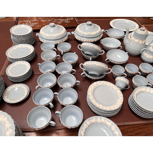 597 - A large quantity of Wedgwood & Barlaston embossed blue Queensware, approx 106 pieces, including ... 