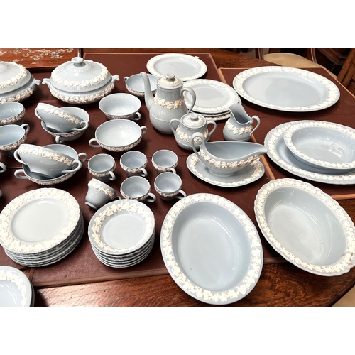 597 - A large quantity of Wedgwood & Barlaston embossed blue Queensware, approx 106 pieces, including ... 