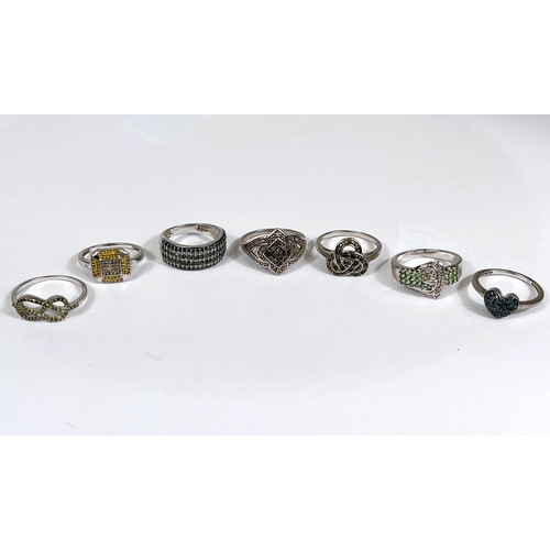 624 - Eight silver rings in a variety of designs, with assorted pavé set coloured stones, 23.1... 