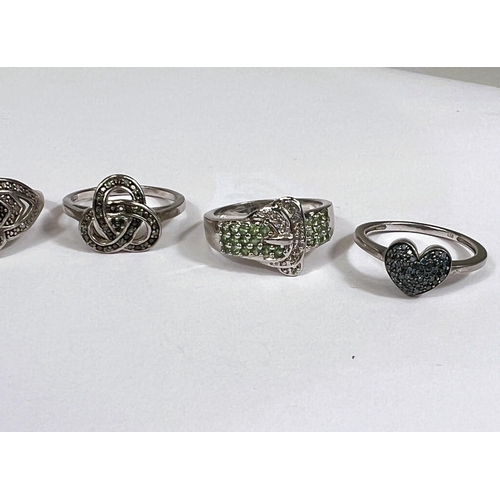 624 - Eight silver rings in a variety of designs, with assorted pavé set coloured stones, 23.1... 