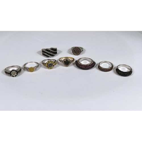 625 - Six silver rings in a variety of designs, with assorted pavé set coloured stones, 38gm