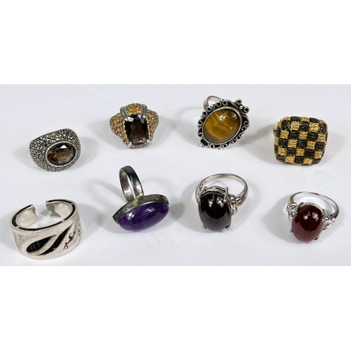 628 - Eight silver rings in a variety of settings and designs, 69.3gm