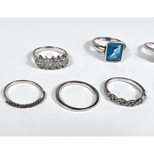 629 - Ten silver rings in a variety of settings and designs, 25.4gm