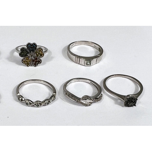 629 - Ten silver rings in a variety of settings and designs, 25.4gm