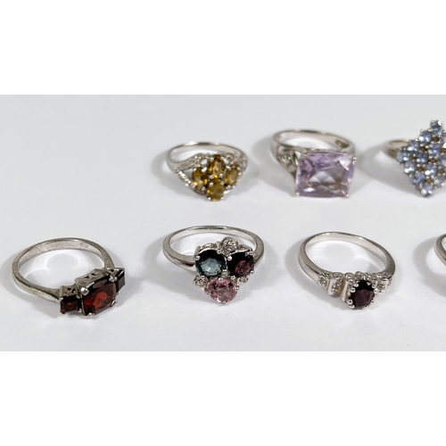 630 - Eight silver rings in a variety of settings and designs, 28.4gm