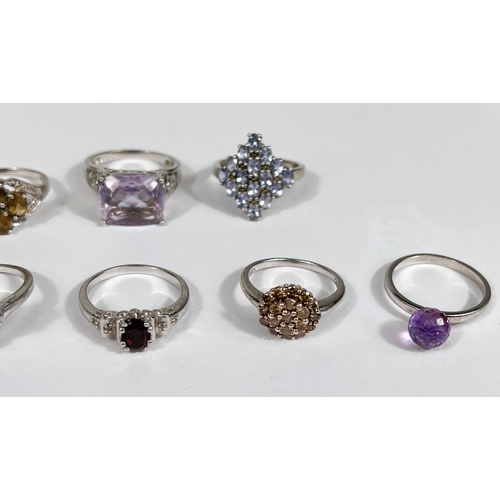 630 - Eight silver rings in a variety of settings and designs, 28.4gm