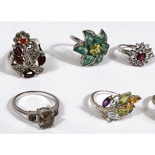 631 - Eight silver rings in a variety of settings and designs, 38.8gm