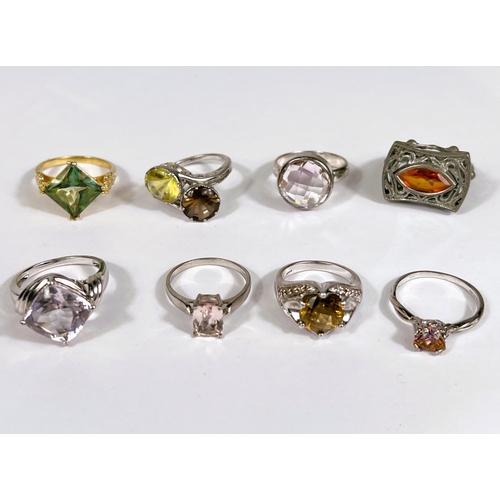 635 - Seven silver rings, and another, in a variety of designs, set assorted coloured stones, 46.5gm