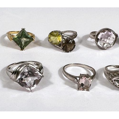 635 - Seven silver rings, and another, in a variety of designs, set assorted coloured stones, 46.5gm