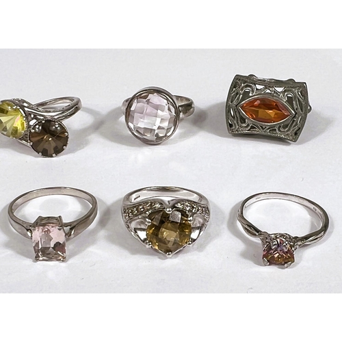 635 - Seven silver rings, and another, in a variety of designs, set assorted coloured stones, 46.5gm