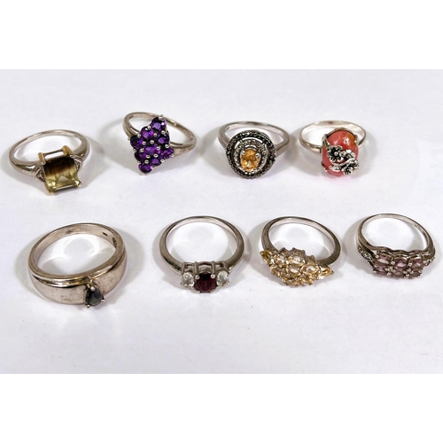 636 - Eight silver rings in a variety of designs, set assorted coloured stones, 27.2gm