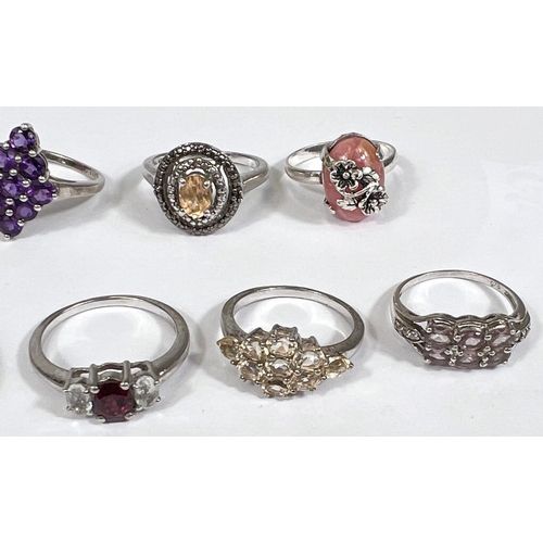 636 - Eight silver rings in a variety of designs, set assorted coloured stones, 27.2gm