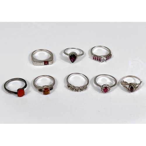 637 - Eight silver rings in a variety of designs, set assorted coloured stones,22.6gm