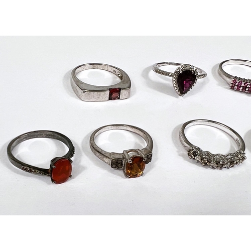 637 - Eight silver rings in a variety of designs, set assorted coloured stones,22.6gm